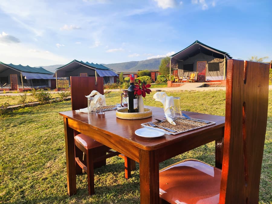 Outdoor dining setup at Endeem Mara Resort tented camp