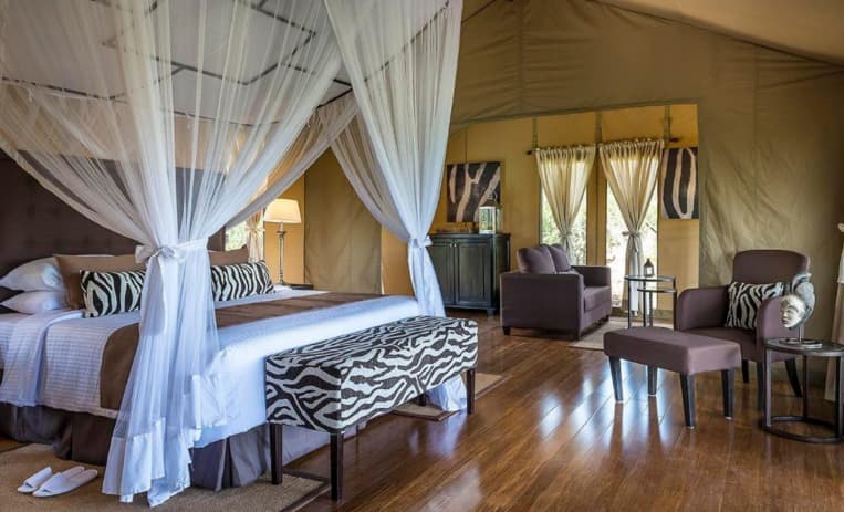 Mutara Camp bedroom with mosquito net bed