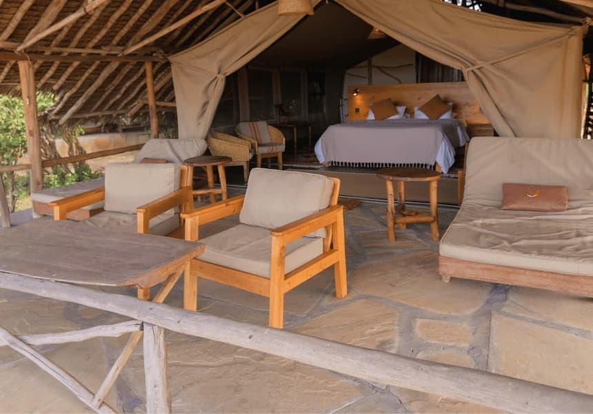 Satao Camp tented room veranda and bed